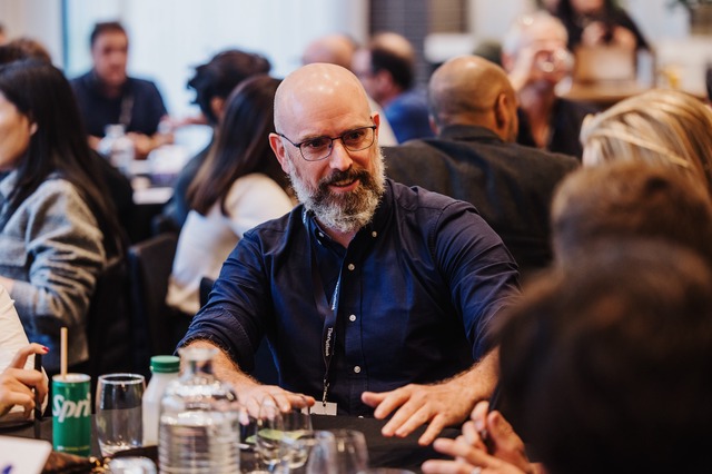Attendees engaged in roundtable discussions during DL25: Melbourne.